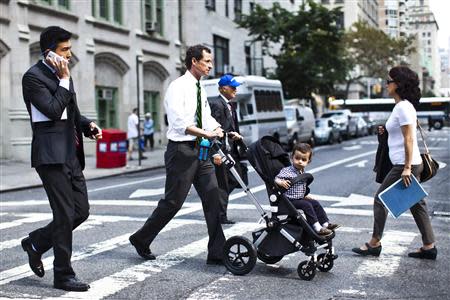 New York City Democratic mayoral candidate Anthony Weiner (C) pushes a stroller with his son, Jordan Weiner, as they arrive to the polling center during the primary election in New York September 10, 2013. REUTERS/Eduardo Munoz