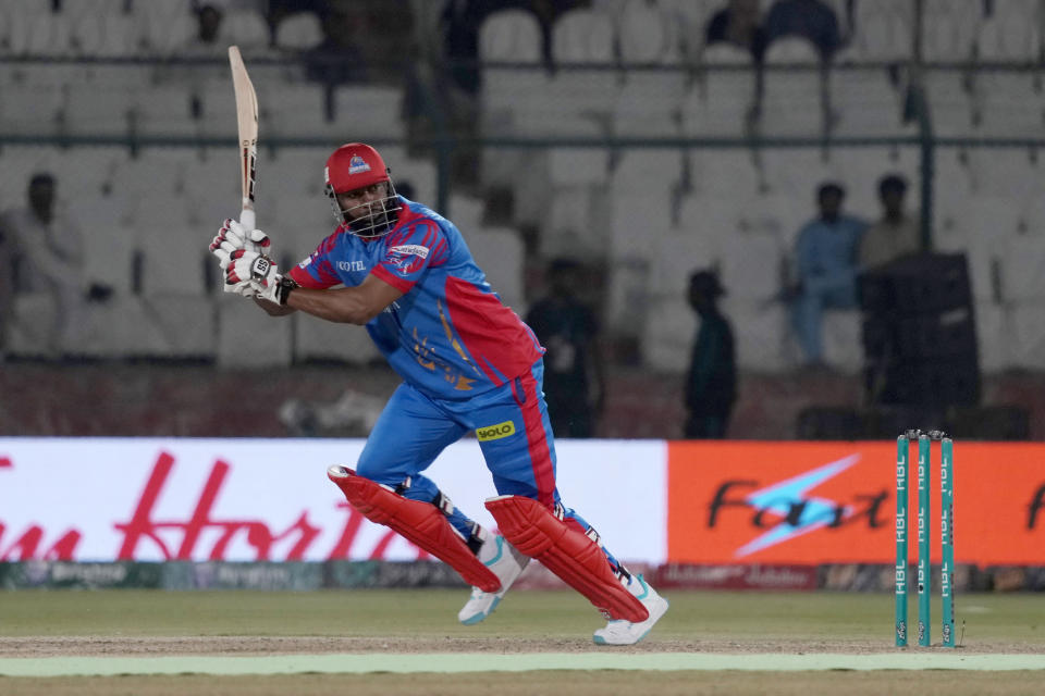 Karachi Kings' Kieron Pollard plays a shot during the Pakistan Super League T20 cricket match between Karachi Kings and Islamabad United, in Karachi, Pakistan, Wednesday, Feb. 28, 2024. (AP Photo/Fareed Khan)