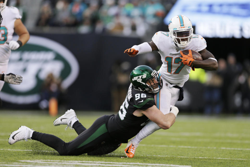 New York Jets defensive end Henry Anderson (96) tackles Miami Dolphins wide receiver Allen Hurns (17) during the second half of an NFL football game, Sunday, Dec. 8, 2019, in East Rutherford, N.J. (AP Photo/Adam Hunger)