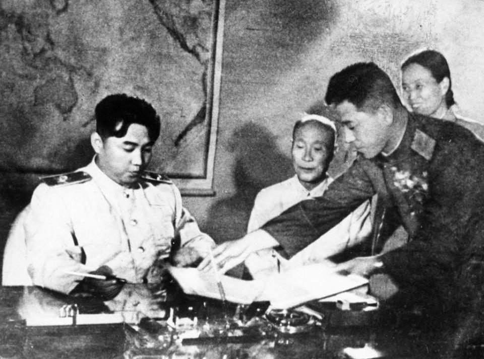 Kim Il Sung signs the Korean Armistice Agreement.