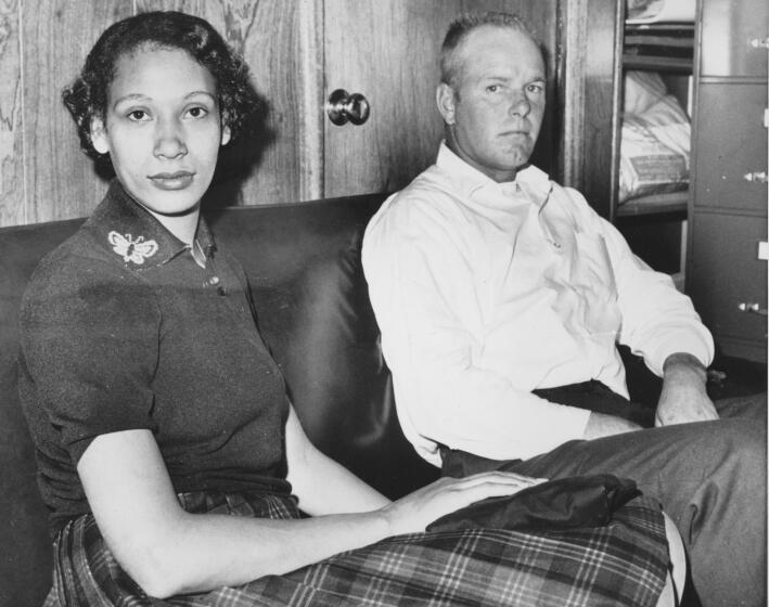 FILE - This Jan. 26, 1965 file photo shows Mildred Loving and her husband Richard P Loving. Bernard S. Cohen, who successfully challenged a Virginia law banning interracial marriage and later went on to a successful political career as a state legislator, has died. He was 86. Cohen and legal colleague Phil Hirschkop represented Richard and Mildred Loving, a white man and Black woman who were convicted of illegally cohabiting as man and wife and ordered to leave Virginia for 25 years(AP Photo, File)