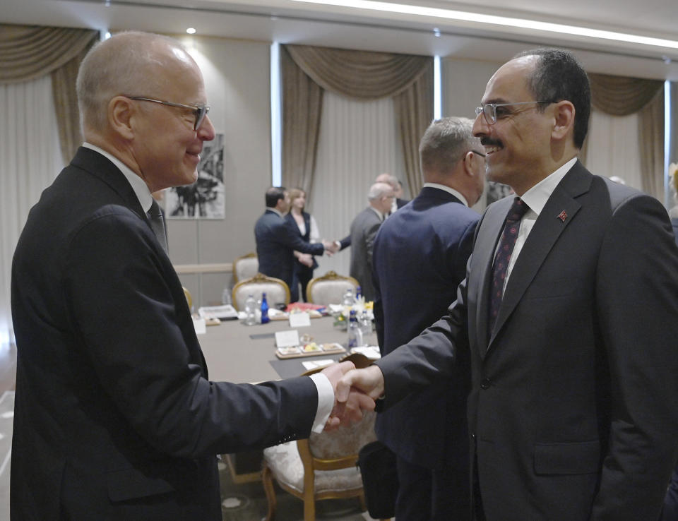 Ibrahim Kalin, the spokesman of President Recep Tayyip Erdogan, right, welcomes Swedish State Secretary Oscar Stenstroem, before a meeting with their delegations, in Ankara, Turkey, Wednesday, May 25, 2022. Senior officials from Sweden and Finland met with Turkish counterparts in Ankara on Wednesday in an effort to overcome Turkey's strong objections to the Nordic nations' bids to join NATO. Sweden and Finland submitted their written applications to join NATO last week.(Turkish Presidency via AP)