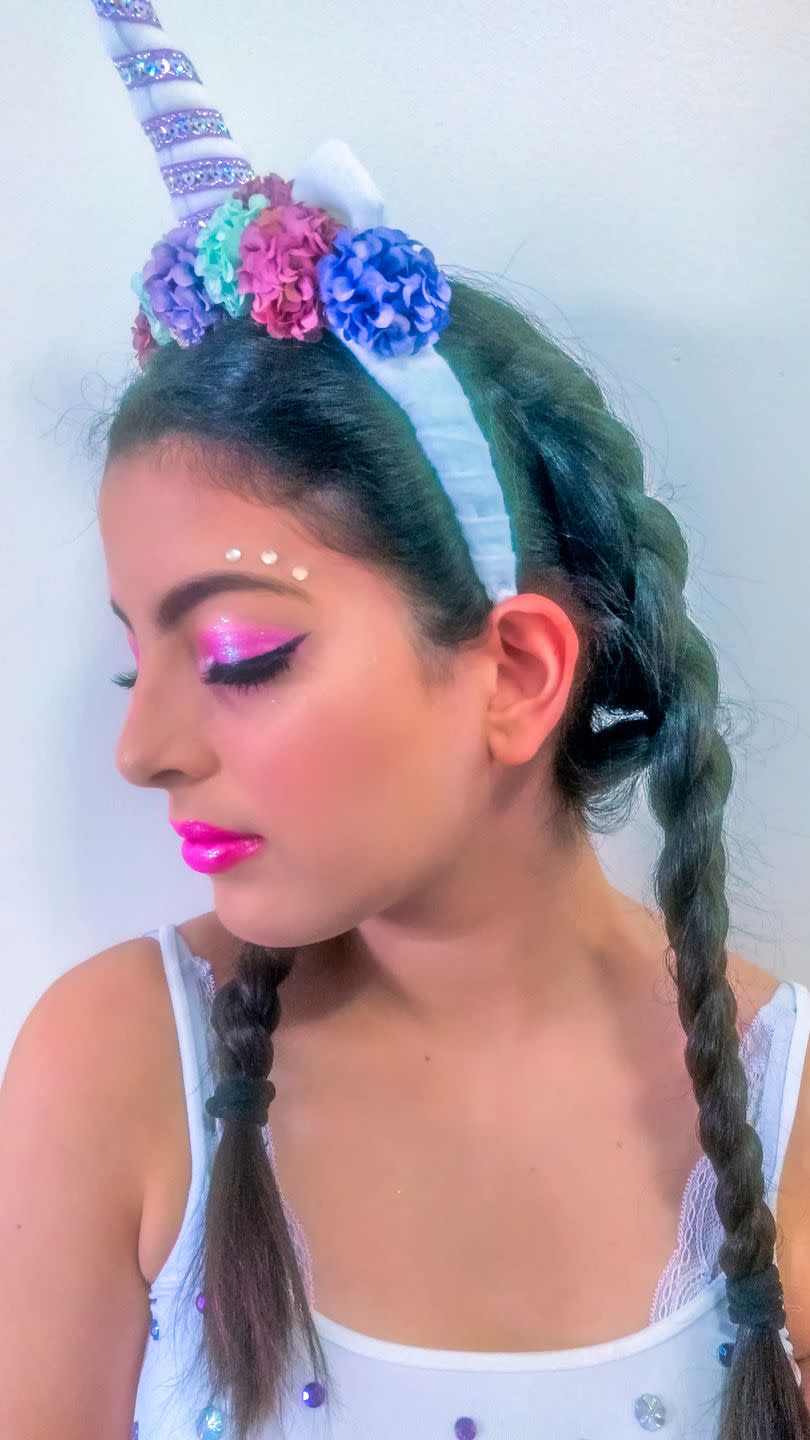 <p>No one is too old to wear unicorn makeup, from kids to grown-ups! Starting with a unicorn horn headband, make the look come to life with sparkling pink eyeshadow, matching pink lip gloss, and a few rhinestones.</p>