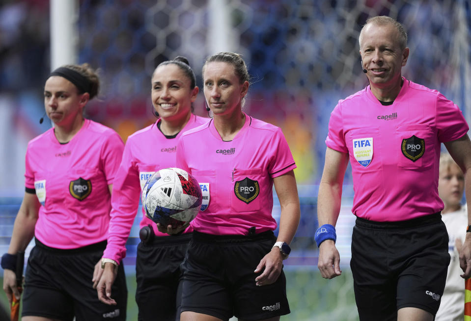 FILE - Referee Tori Penso, second from right; fourth official Felisha Mariscal, second from left; and assistant referees Brooke Mayo, left, and Corey Rockwell, right, walk onto the field before the Vancouver Whitecaps and Colorado Rapids played in an MLS soccer match Saturday, April 29, 2023, in Vancouver, British Columbia. Major League Soccer will lock out referees after its union rejected a tentative contract, putting Lionel Messi’s Inter Miami on track to open the season next week with replacement officials. The Professional Soccer Referees Association said Saturday, Feb 17, 2023, in a statement that the tentative agreement lacked a sufficient economic package and quality-of-life improvements. The league said PRO will lock out the union on Sunday. (Darryl Dyck/The Canadian Press via AP, File)