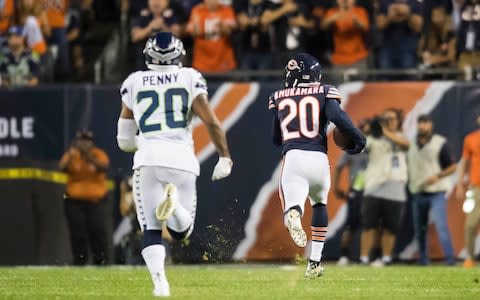 Chicago Bears defensive back Prince Amukamara (20) runs an interception of a pass intended for Seattle Seahawks running back Rashaad Penny (20) in for a touchdown during the second half  - Credit: Patrick Gorski/USA Today