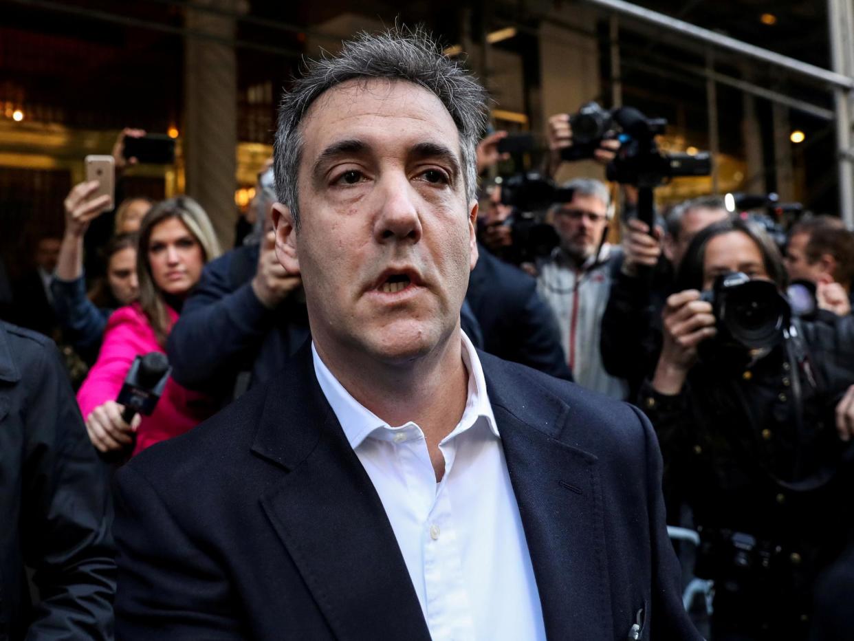 Michael Cohen leaving his apartment to report to prison: (Jeenah Moon Reuters)