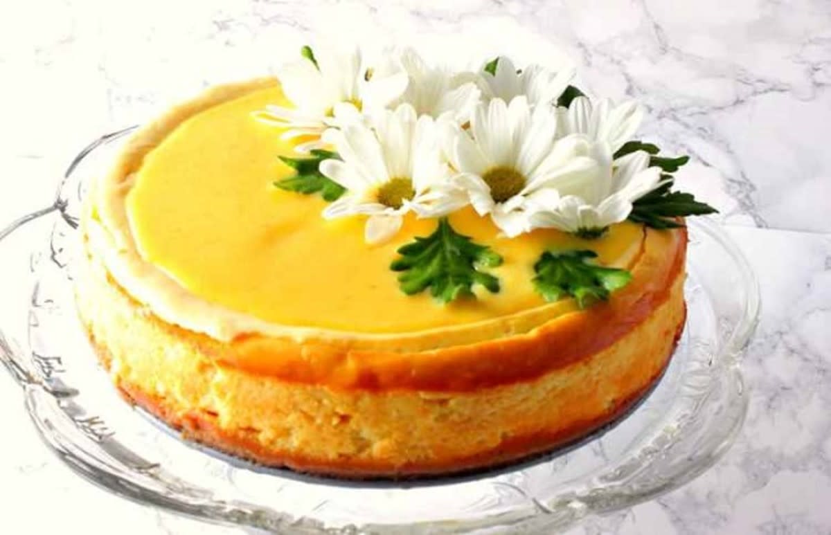 <p>Kudos Kitchen by Renee</p><p>If you'd like to surprise your family and friends with a showstopping dessert, then this lovely lemon cheesecake with lemon curd topping is just the thing! <a href="https://www.kudoskitchenbyrenee.com/lemon-cheesecake-lemon-curd-topping/" rel="nofollow noopener" target="_blank" data-ylk="slk:Get the recipe here;elm:context_link;itc:0;sec:content-canvas" class="link rapid-noclick-resp">Get the recipe here</a></p>