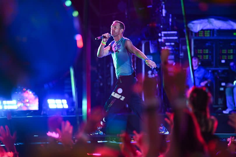 Chris Martin of the band ColdPlay perform on stage during day four of Glastonbury Festival 2024 at Worthy Farm, Pilton on June 29, 2024 in Glastonbury