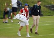 Britain Tennis - Wimbledon - All England Lawn Tennis & Croquet Club, Wimbledon, England - 1/7/16 Great Britain's Andy Murray on the practice courts as rain delays play REUTERS/Paul Childs