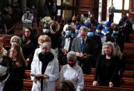 Congregants attend a memorial service for the late Queen Elizabeth in Zimbabwe