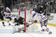 Edmonton Oilers left wing Warren Foegele (37) shoots against Los Angeles Kings goaltender Joonas Korpisalo (70) during the third period of Game 4 of an NHL hockey Stanley Cup first-round playoff series hockey game Sunday, April 23, 2023, in Los Angeles. (AP Photo/Ashley Landis)