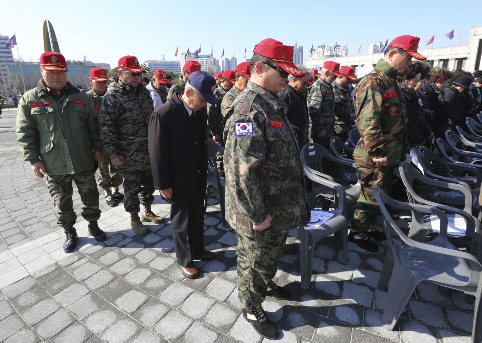 South Korean veterans pay a silent tribute during a ceremony to commemorate South Korean soldiers killed in three major clashes with North Korea in the West Sea, in Seoul, South Korea, Friday, March 22, 2019. The South Korean government has designated the fourth Friday of March as the commemoration day for the fallen soldiers in the clashes, including the North's torpedoing of the South Korean Navy corvette Cheonan in 2010, which killed 46 sailors. (AP Photo/Ahn Young-joon)