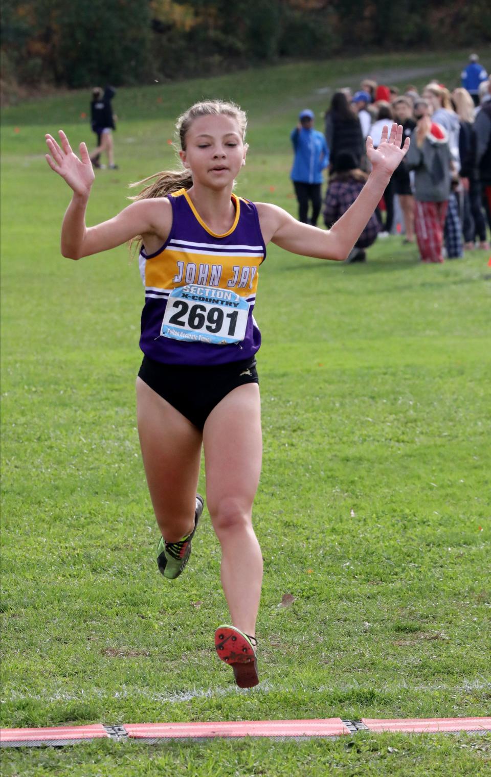 Sloan Wasserman from John Jay-Cross River approaches the finish line as athletes compete in the girls Class B Section 1 Cross Country Championships at Bowdoin Park in Wappingers Falls, Nov. 4, 2023.