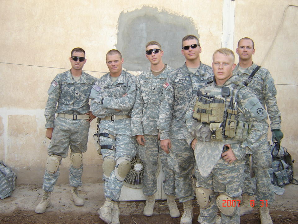 Michael Froede standing with fellow soldiers.