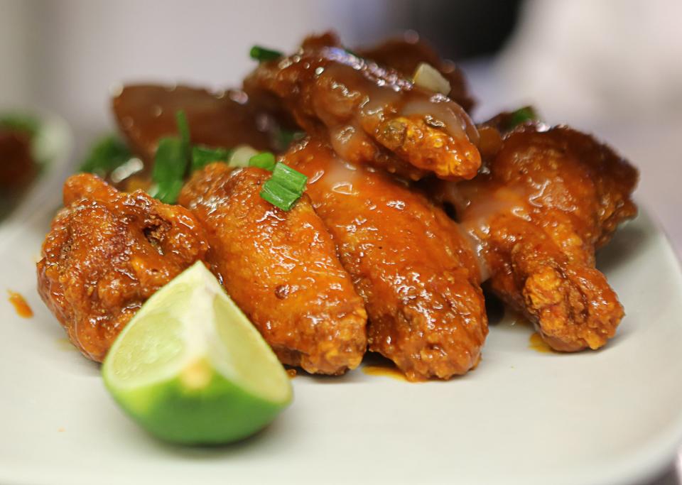 A plate of chicken wings with a tequila pineapple barbecue sauce is one of the wings made by chefs at Kid Shelleen's in Wilmington.