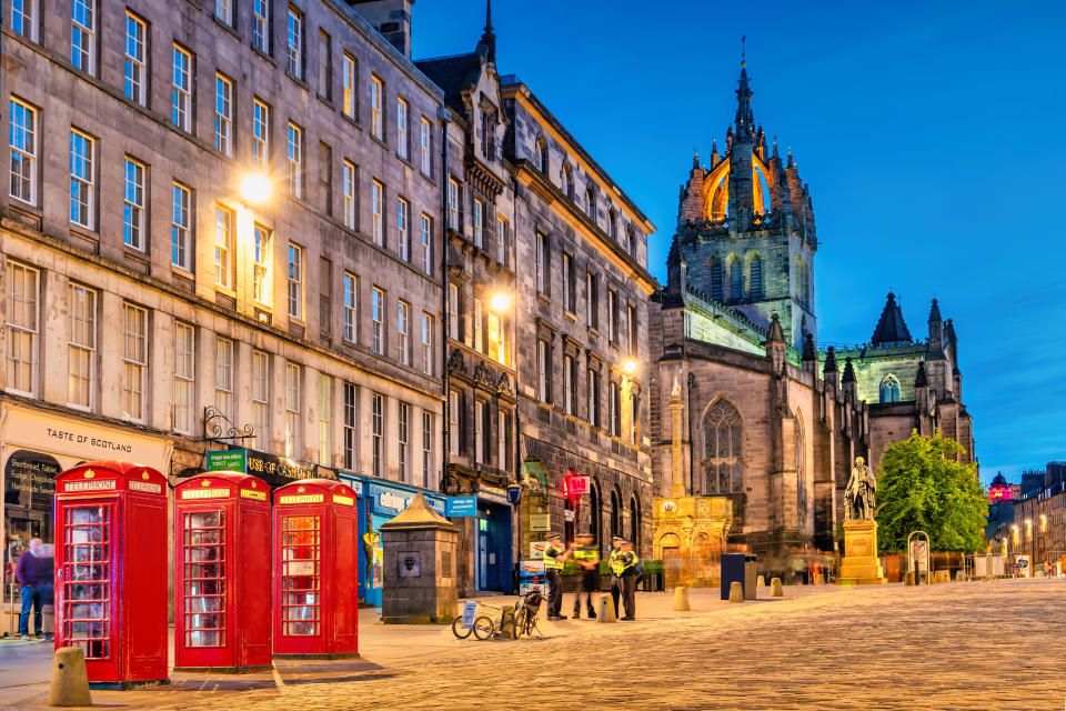 Royal Mile in Old Town Edinburgh Scotland at twilight blue hour.