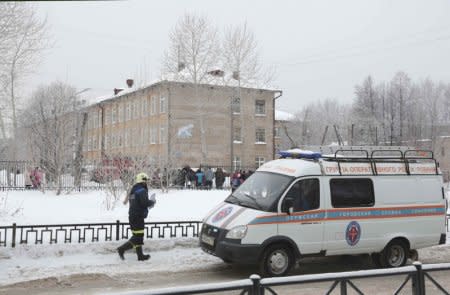 A vehicle of the Russian Emergencies Ministry is parked near a local school after reportedly several unidentified people wearing masks injured schoolchildren with knives in the city of Perm, Russia January 15, 2018. REUTERS/Maksim Kimerling