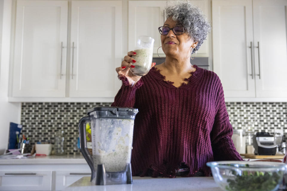 person drinking a smoothie