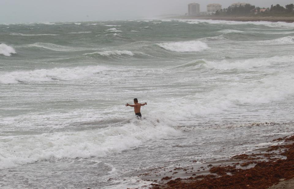 Jacob Todechine of Gallup, New Mexico, plays in the surf at Fort Pierce Beach as Potential Tropical Cyclone One moves over the area Saturday, June 4, 2022.