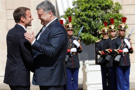 French President Emmanuel Macron meets with Ukrainian President Petro Poroshenko at the Elysee Palace in Paris, France, June 26, 2017. REUTERS/Philippe Wojazer