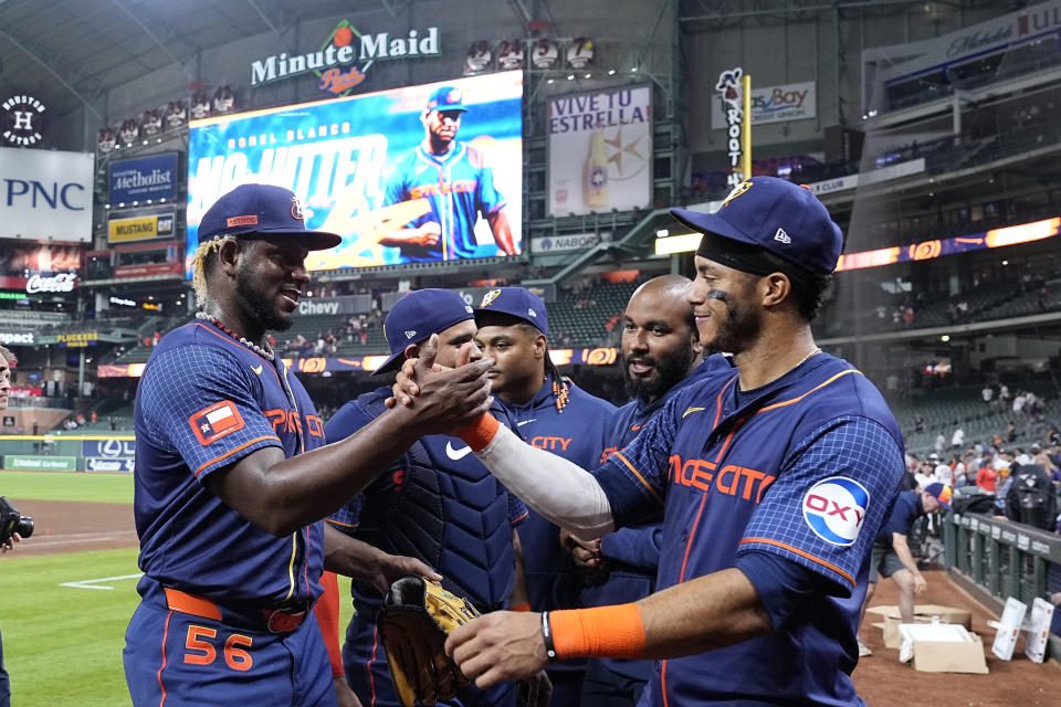 Houston Astros starting pitcher Ronel Blanco high-fives Jeremy Pena after throwing a no hitter in a baseball game against the Toronto Blue Jays, Monday, April 1, 2024, in Houston. (AP Photo/Kevin M. Cox)