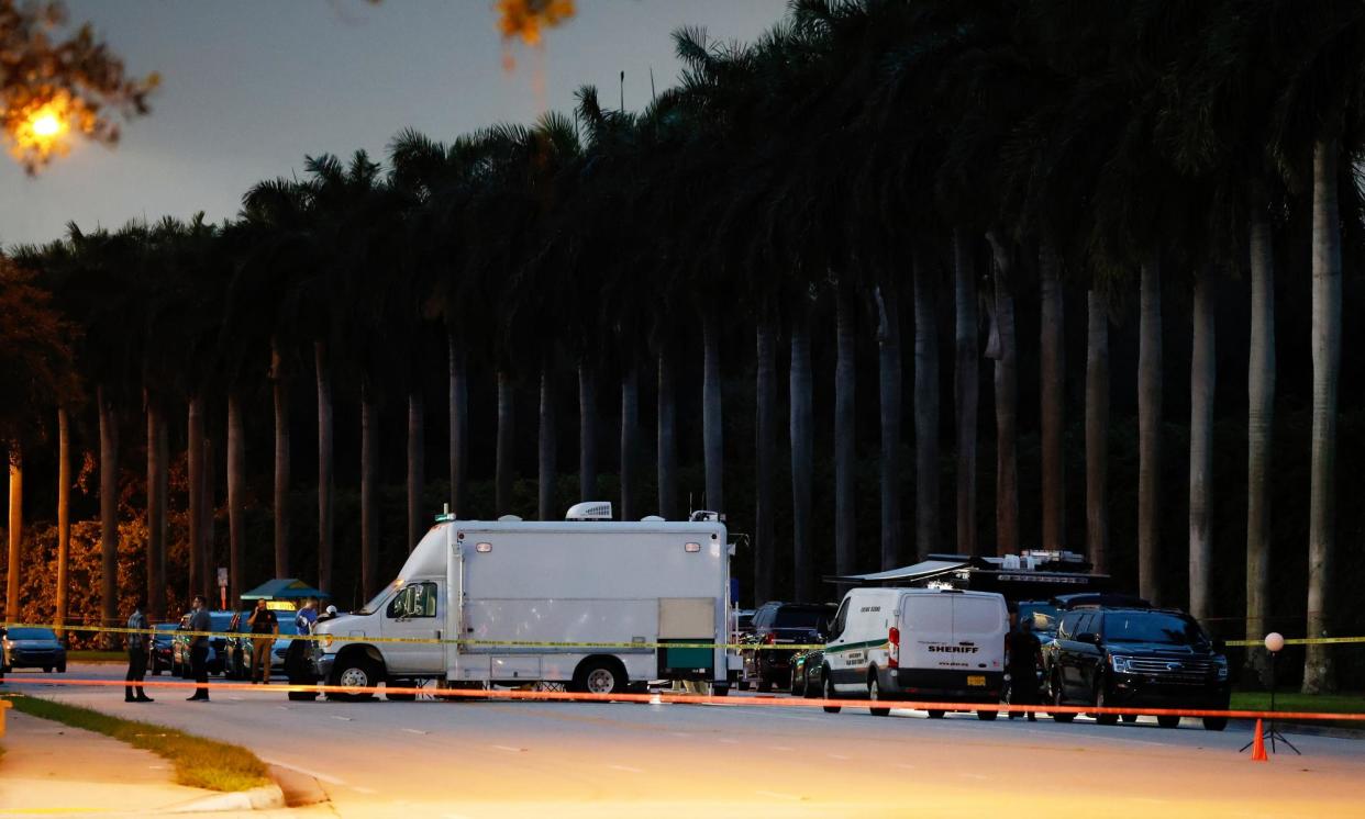 <span>Police crime scene vehicles are seen at Trump International golf club following the apparent assassination attempt against the former president.</span><span>Photograph: Terry Renna/AP</span>