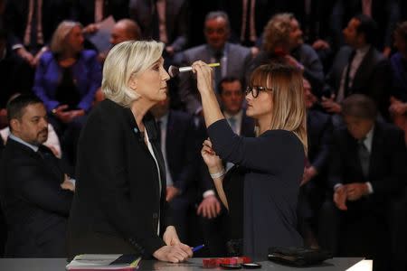 Candidate for the 2017 presidential election Marine Le Pen, French National Front (FN) political party leader, gets make-up before a debate organised by French private TV channel TF1 in Aubervilliers, outside Paris, France, March 20, 2017. REUTERS/Patrick Kovarik/Pool