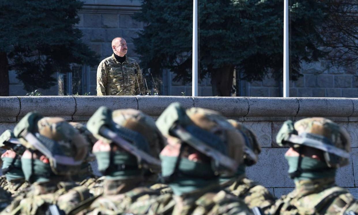 <span>Azerbaijan's president, Ilham Aliyev, watches a military parade in Nagorno-Karabakh after an offensive displaced 100,000 ethnic Armenians from the disputed territory last year.</span><span>Photograph: President of the Republic Of Azerbaijan/Reuters</span>