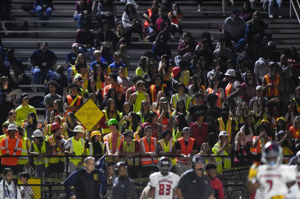 The Grovetown fan section dressed as construction workers at the Evans and Grovetown football game at Evans High School on Friday, Sept. 23, 2022. Evans defeated Grovetown 42-15. 