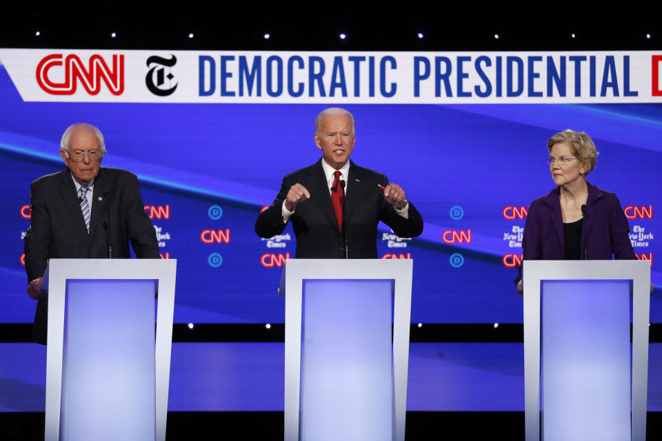 Democratic presidential candidate Sen. Bernie Sanders, I-Vt., left, former Vice President Joe Biden and Sen. Elizabeth Warren, D-Mass., right, participate in a Democratic presidential primary debate hosted by CNN/New York Times at Otterbein University, Tuesday, Oct. 15, 2019, in Westerville, Ohio. (AP Photo/John Minchillo)