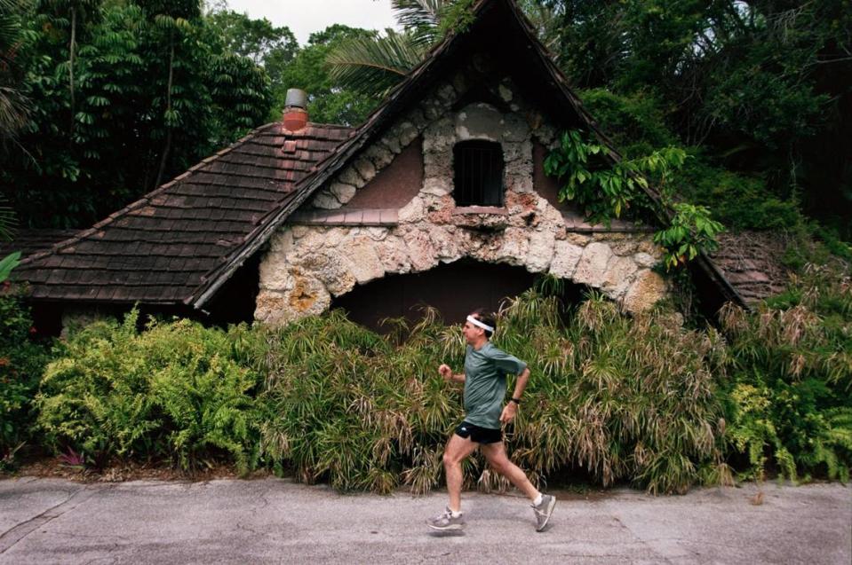 A jogger passes the old 1936 entrance to Parrot Jungle.