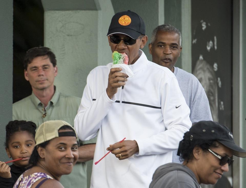 President Barack Obama has shave ice with friends at Island Snow in Kailua on January 1, 2015. 