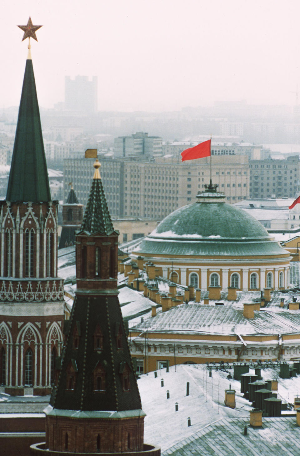 FILE - The Soviet red flag towers above the Kremlin as political power shifts to reveal a new system in Moscow, on Wednesday, Dec. 18, 1991. After Soviet President Mikhail Gorbachev stepped down on Dec. 25, 1991, people strolling across Moscow's snowy Red Square on the evening of Dec. 25, were surprised to witness one of the 20th century’s most pivotal moments — the Soviet red flag over the Kremlin pulled down and replaced with the Russian Federation's tricolor. (AP Photo/Boris Yurchenko, File)