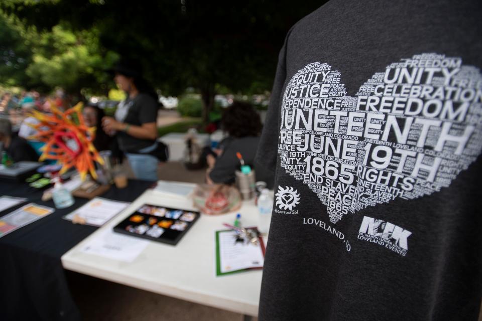 A commemorative T-shirt stands on display during the first Juneteenth holiday celebration at The Foote Lagoon in Loveland on June 19, 2021. Fort Collins is hosting its first full weekend of Juneteenth events this year. Coloradoan file photo