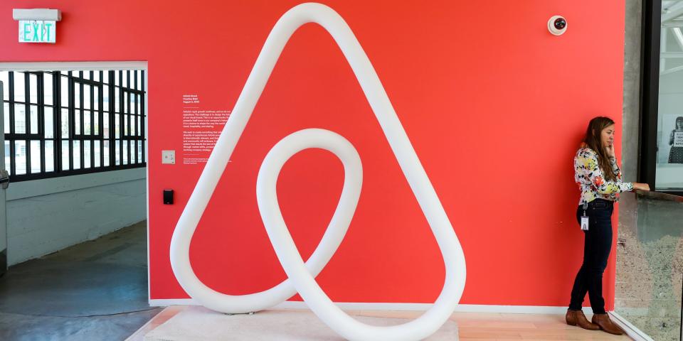 FILE PHOTO: A woman talks on the phone at the Airbnb office headquarters in the SOMA district of San Francisco, California, U.S., August 2, 2016.  REUTERS/Gabrielle Lurie/File Photo