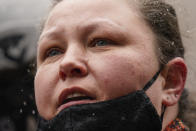 Katie Wright, center, mother of Daunte Wright, speaks during a news conference in snowfall, Tuesday, April 13, 2021, in Minneapolis. Daunte Wright, 20, was shot and killed by police Sunday after a traffic stop in Brooklyn Center, Minn. (AP Photo/John Minchillo)