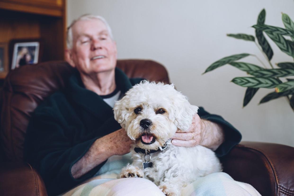 Elderly man with his pet dog