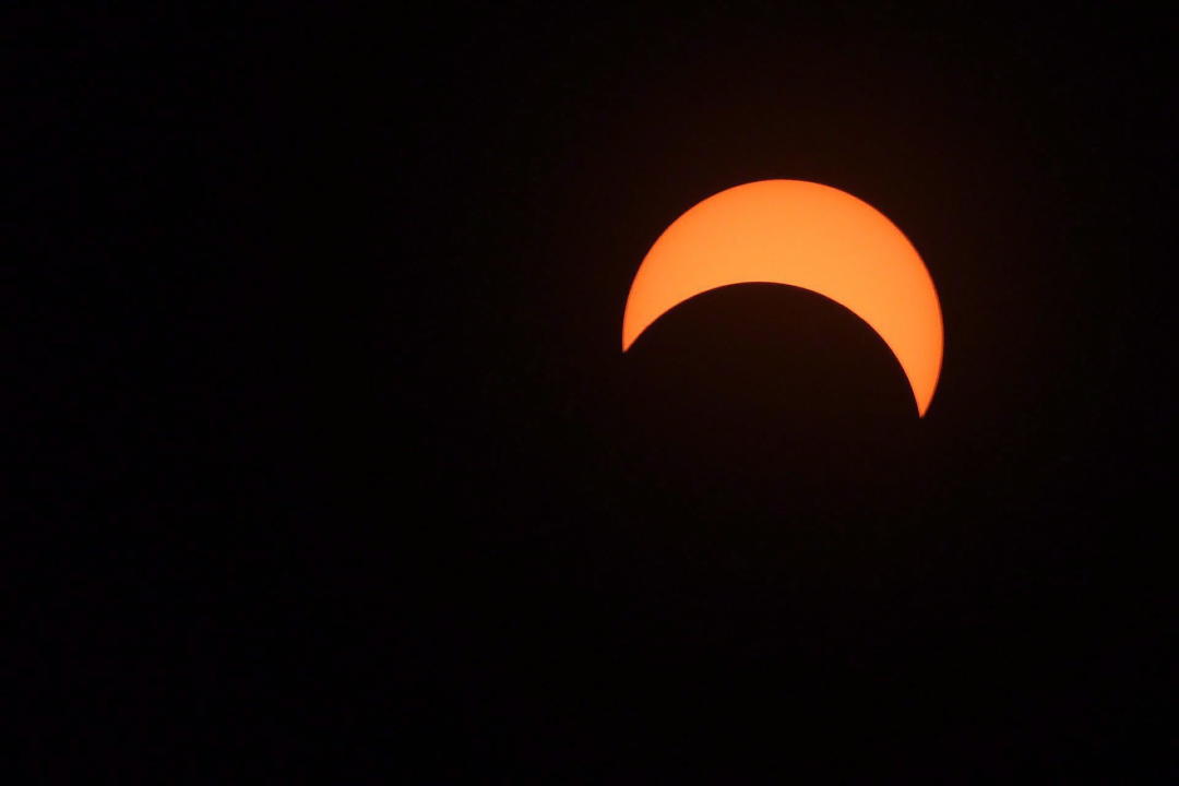 The moon covers the sun during a partial solar eclipse in Ottawa on Monday, August 21, 2017. THE CANADIAN PRESS/Sean Kilpatrick