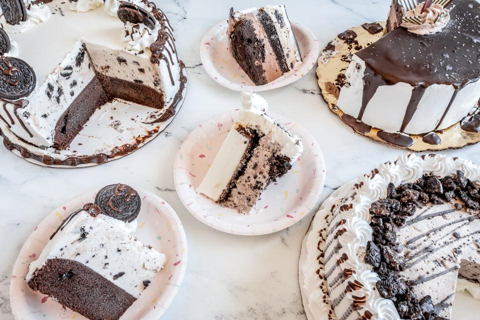 three ice cream cakes with slices