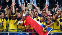 FILE PHOTO: Arsenal celebrate with the FA Cup after beating Aston Villa 4-0 in the final at Wembley Stadium.