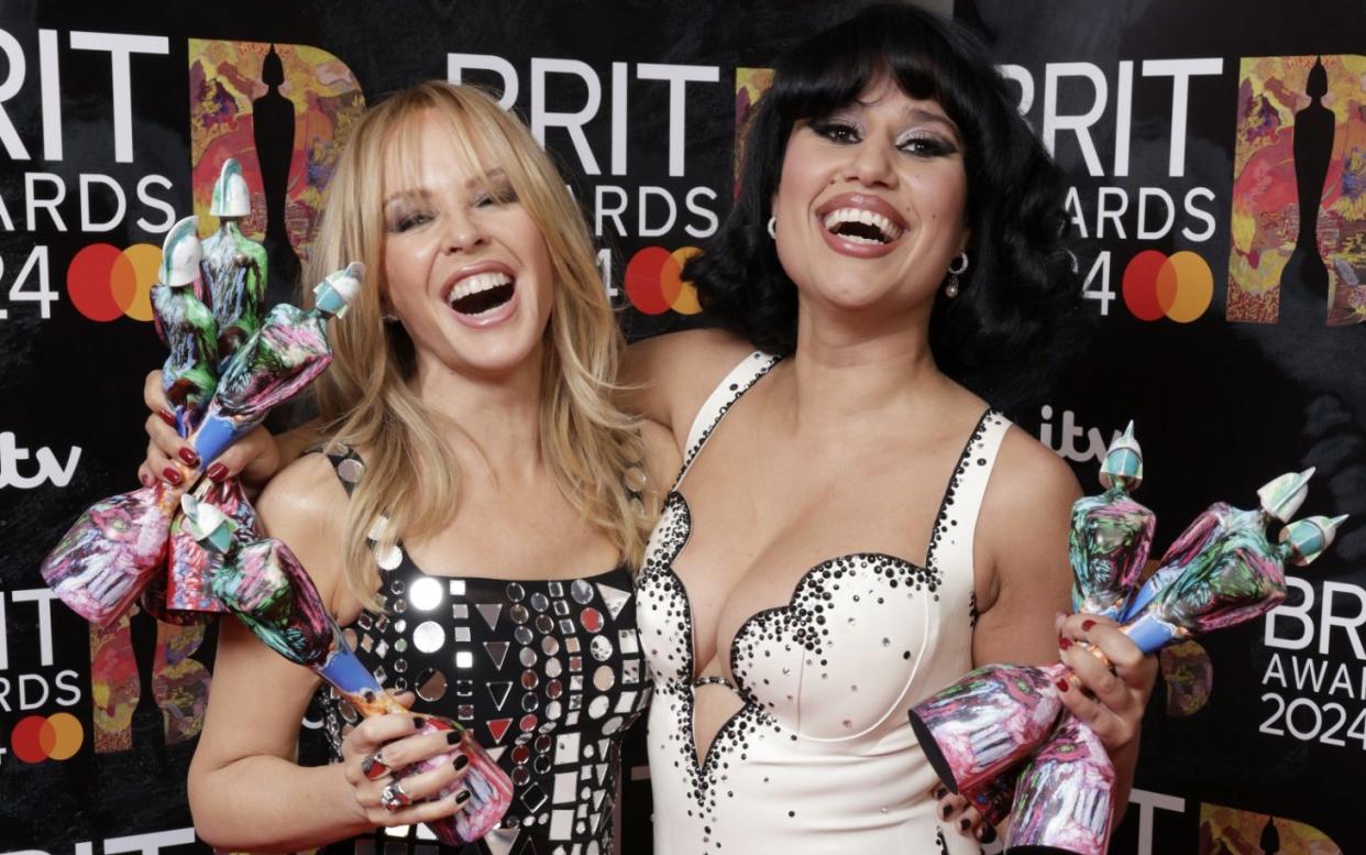 Kylie Minogue and Raye pose in the Winners Room