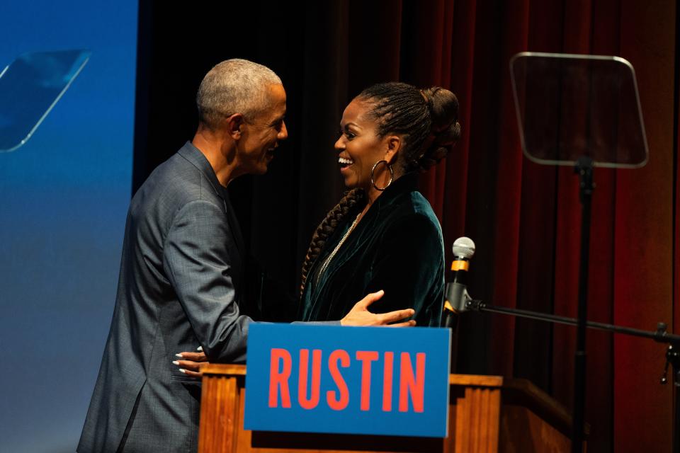 Former First Lady Michelle Obama greets former President Barack Obama at a screening of the Netflix film "Rustin" during the inaugural HBCU First Look Film Festival, which took place at the National Museum of African American History & Culture on Nov. 10, 2023, in Washington, DC.