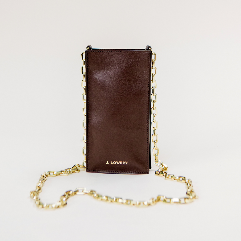 <p><a href="https://shopjlowery.com/collections/fall-winter-2023/products/phone-pouch-espresso-brown" rel="nofollow noopener" target="_blank" data-ylk="slk:Shop Now;elm:context_link;itc:0;sec:content-canvas" class="link ">Shop Now</a></p><p>J. Lowery Phone Pouch</p><p>shopjlowery.com</p><p>$215.00</p>