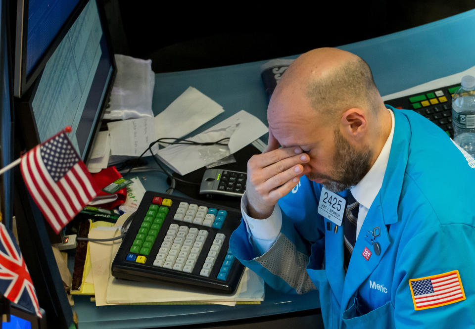 BEIJING , March 9, 2020  -- File photo taken on March 6, 2020 shows a trader working at the New York Stock Exchange  in New York, the United States. U.S. stocks plunged in early trading on Monday as investors fled the market amid anxieties for a possible all-out oil price war and economic slowdown from the spreading coronavirus. (Photo by Michael Nagle/Xinhua via Getty Images)