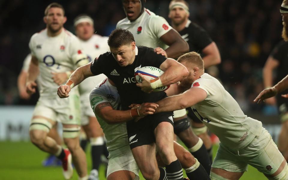 Beauden Barrett of New Zealand is tackled during the Quilter International match between England and New Zealand - Getty Images