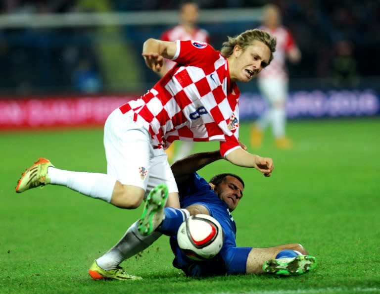 Croatia's Alen Halilovic (L) fights for the ball with Azerbaijan's Maksim Medvedev during a Euro 2016 qualifying match in Osijek, in 2014