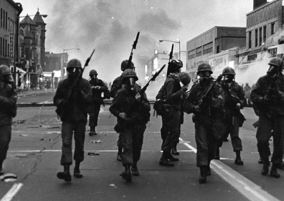 Troops march along a street in Washington in April 1968, responding to protests that turned violent following the assassination of Martin Luther King Jr. in Memphis, Tennessee. The grief and anger caused by his killing sparked tumult in cities throughout the U.S. (Photo: The Washington Post via Getty Images)