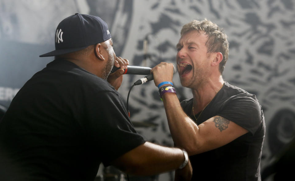 FILE - In this March 14, 2014 file photo, Damon Albarn, right, is joined by De La Soul's Vincent Mason while performing during the SXSW Music Festival in Austin, Texas. Albarn's new album, "Everyday Robots," released on Monday, April 28, 2014. (Photo by Jack Plunkett/Invision/AP, file)