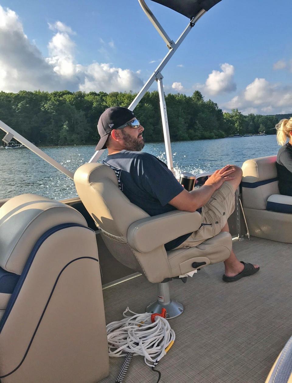 Jay Mills goes for a spin in a friend's boat on Deep Creek Lake in Garrett County in July of 2020.