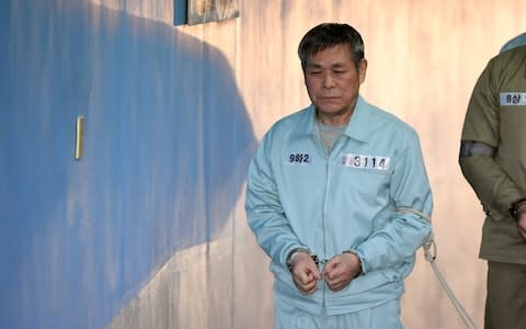 South Korean pastor Lee Jaerock arrives at the Seoul Central District Court to attend his trial in Seoul  - Credit: AFP